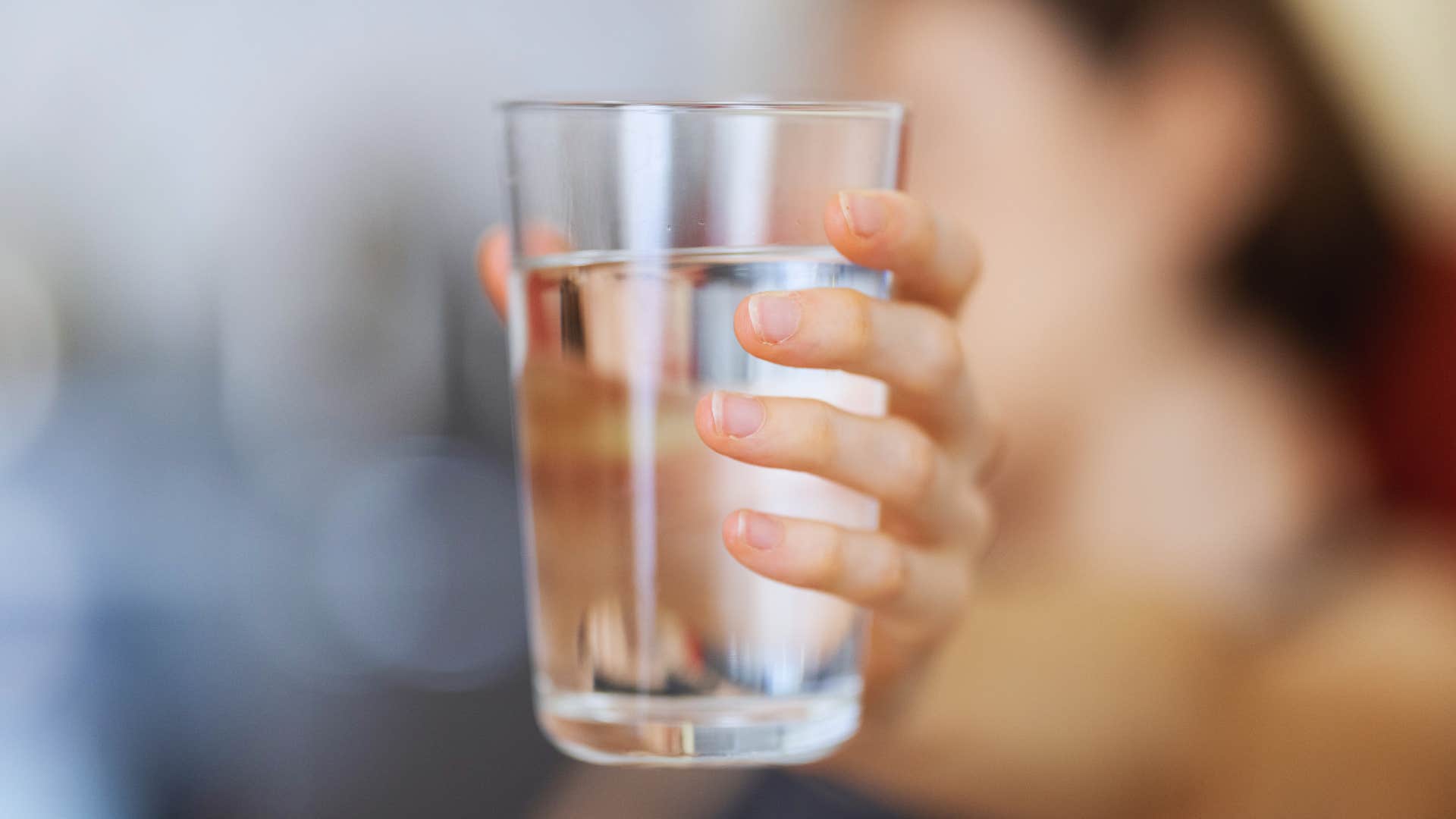 woman manifesting by asking her water for what she wants