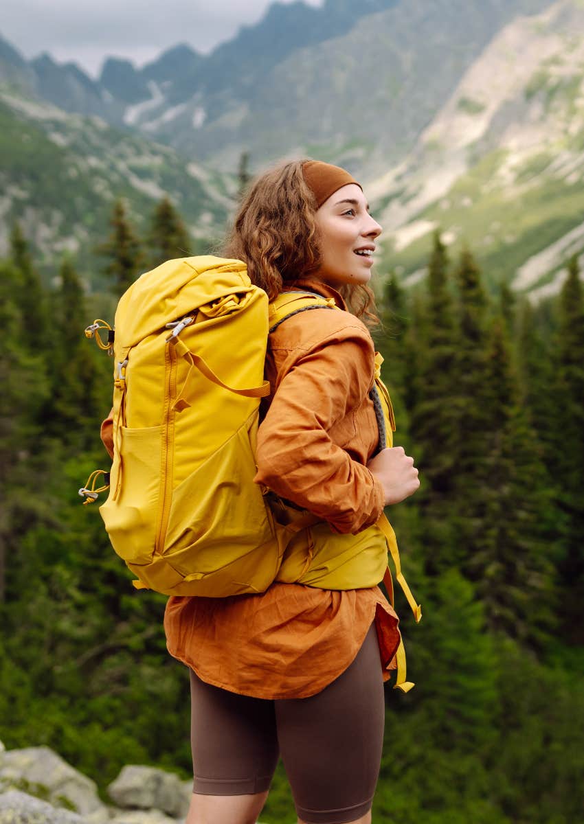 happy woman doing challenging outdoor hike
