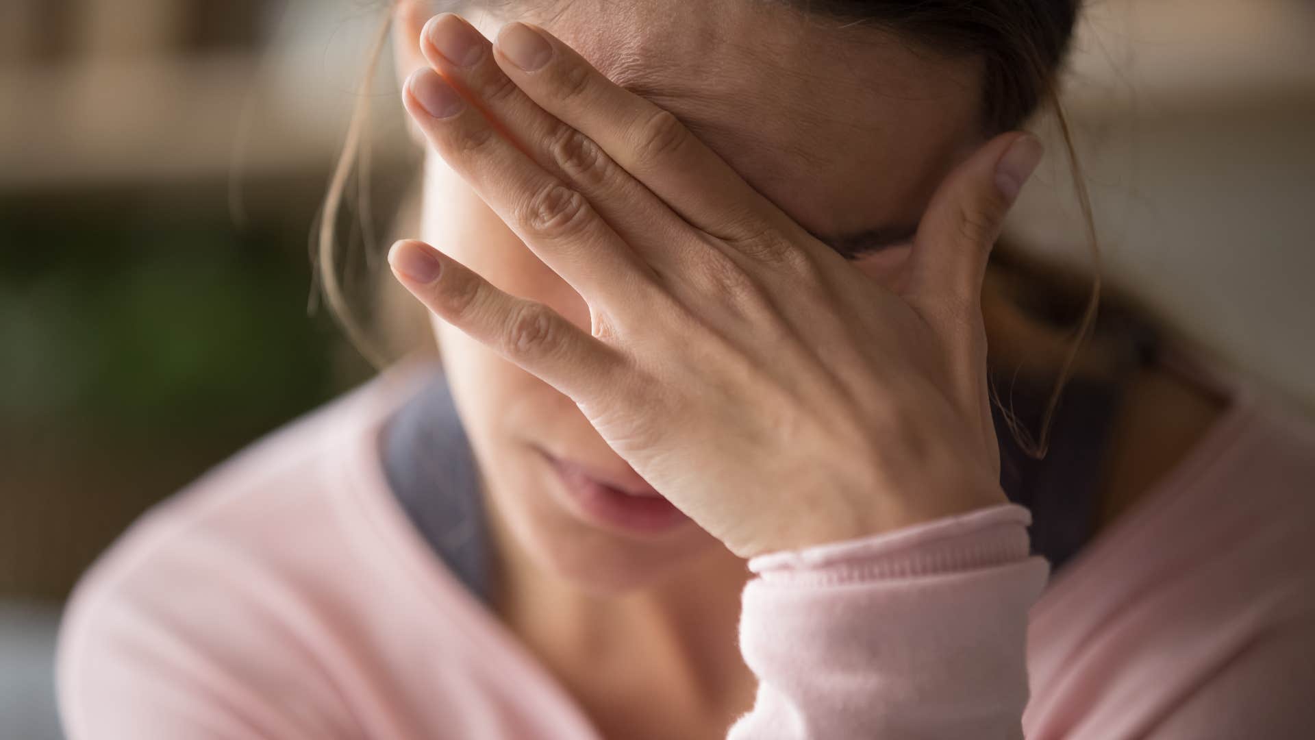 woman withdrawing to avoid facing real emotions