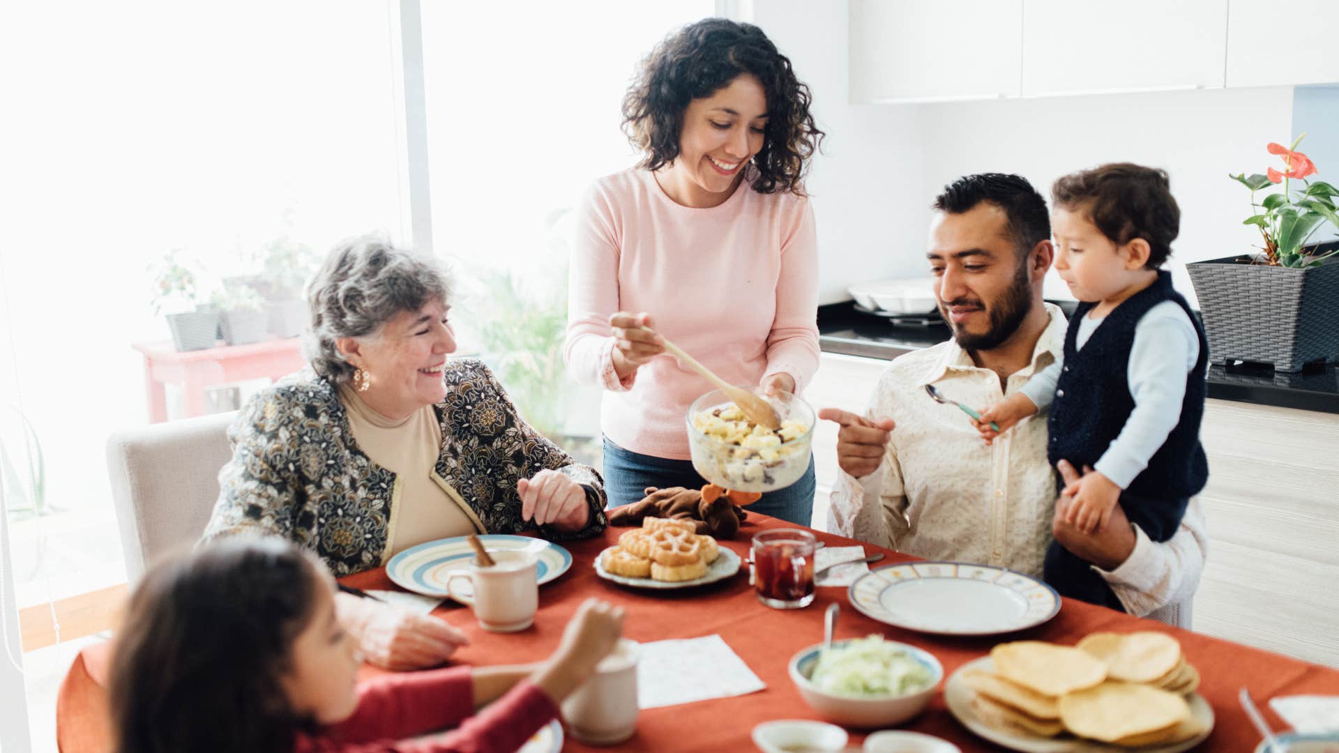 family having their meal at the dinner table