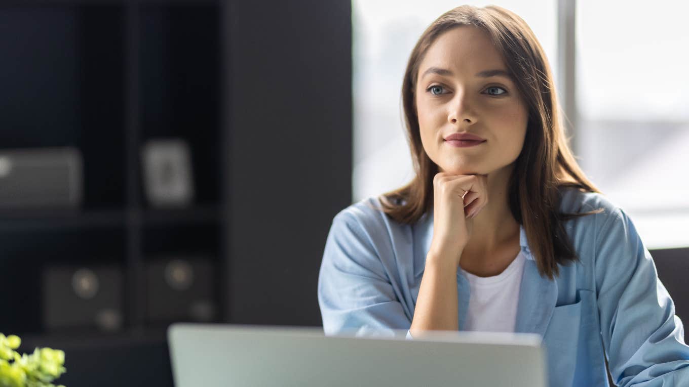 Email Phrases That Hurt Your Chances For A Promotion, According To A CEO woman using email phrases that hurt chances for promotion