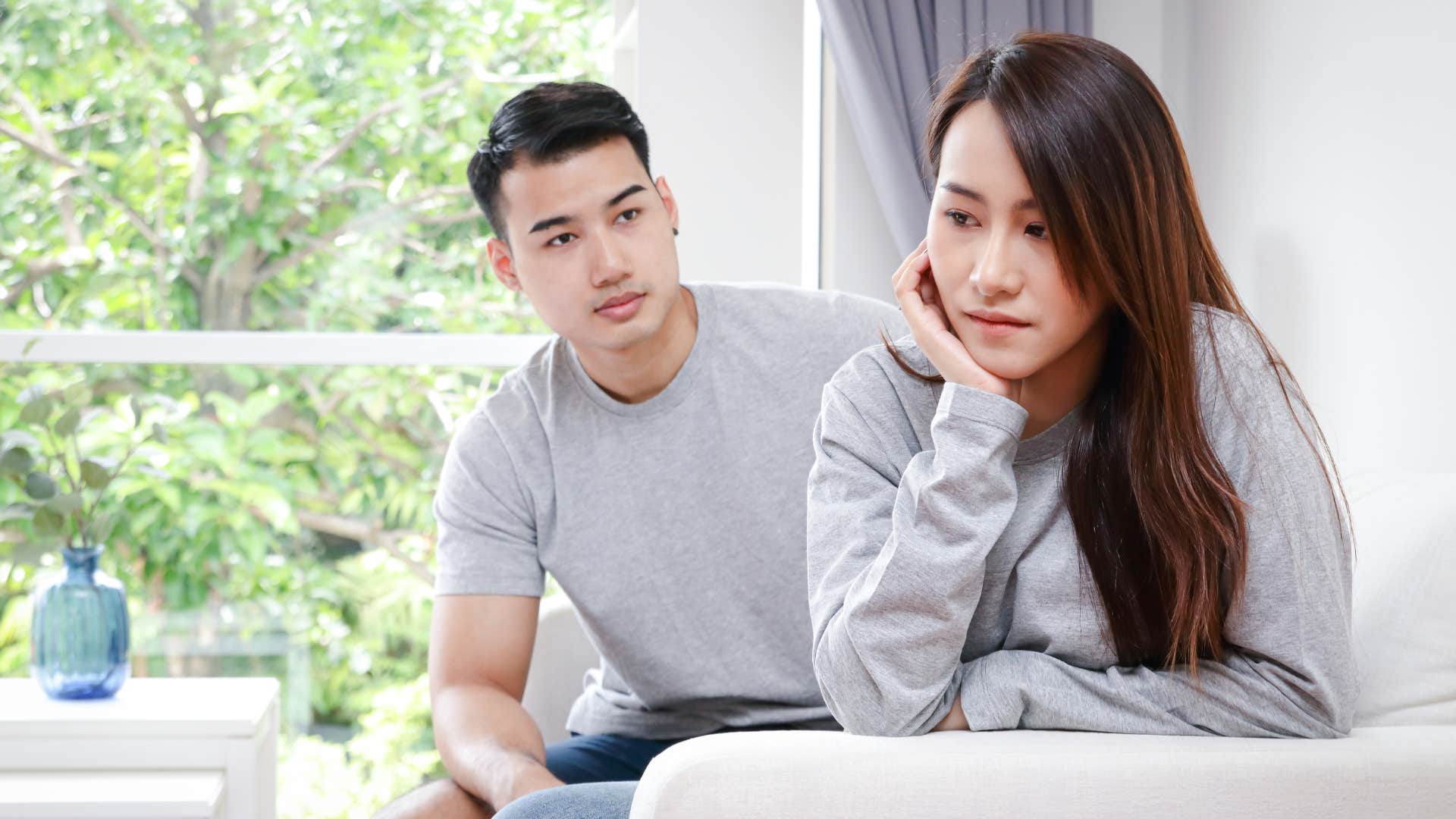 husband trying to comfort sad and stressed wife