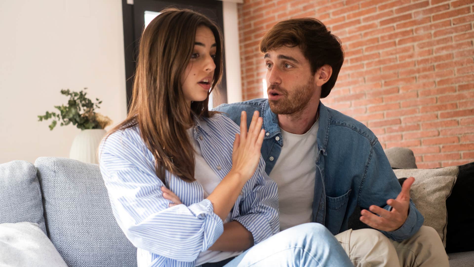 woman avoids conflict as man in white shirt pleads with her to talk 