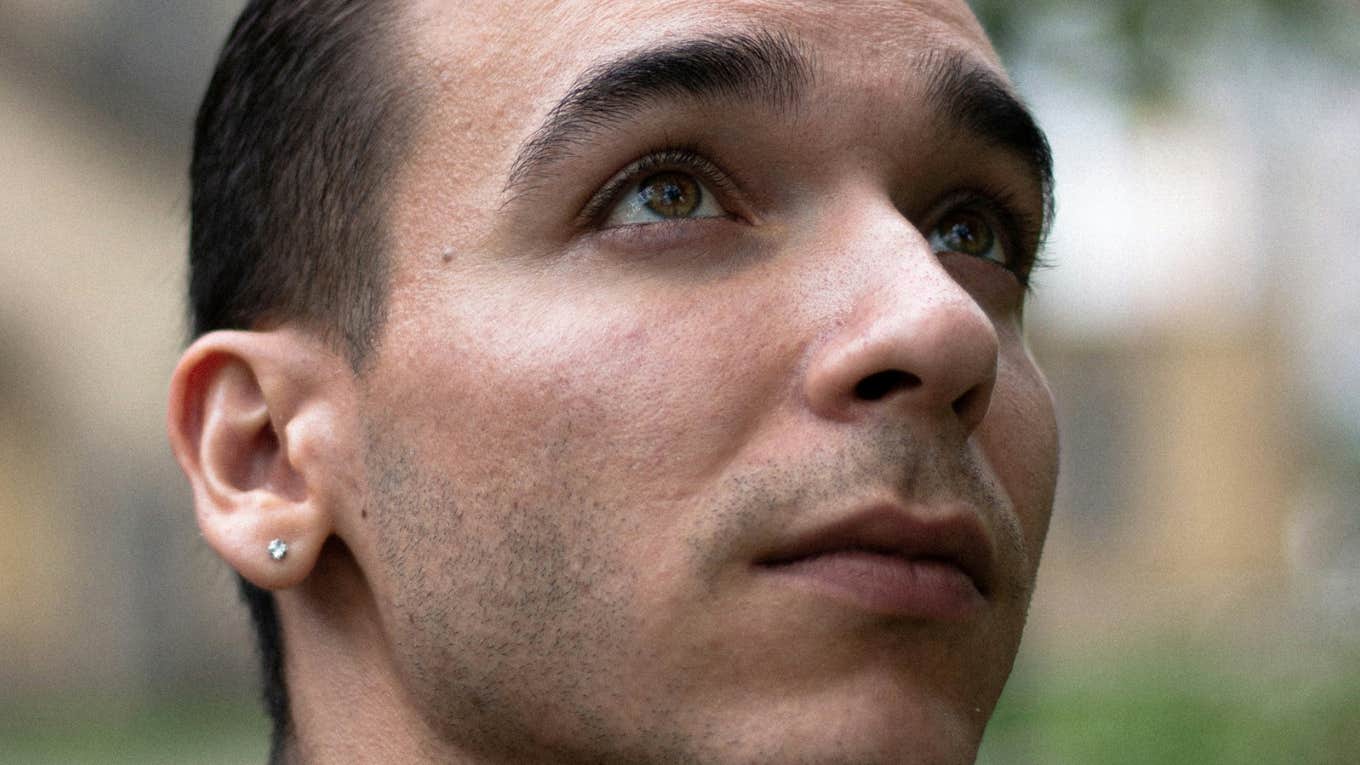 Clues You're Falling for Someone Who Can’t Emotionally Show Up for You, According To Psychology Man is falling for someone who can't emotionally show up.