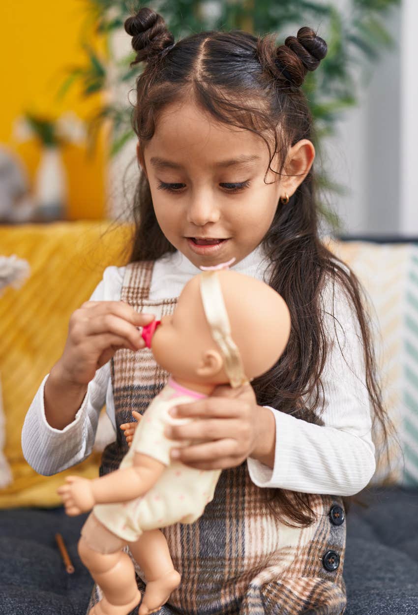 Little girl playing house dad criticized encouraging her to be a housewife