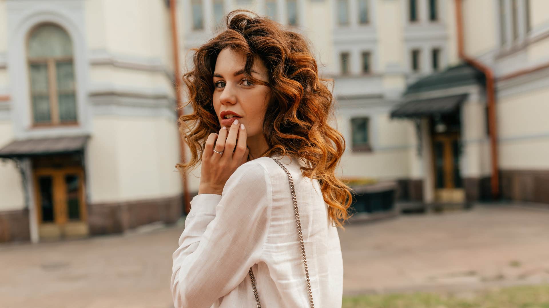 a woman is acting mysterious by not telling anyone where she goes