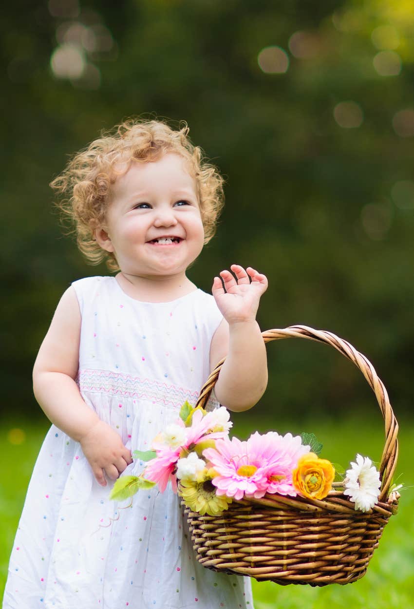 flower girl at wedding with curly hair
