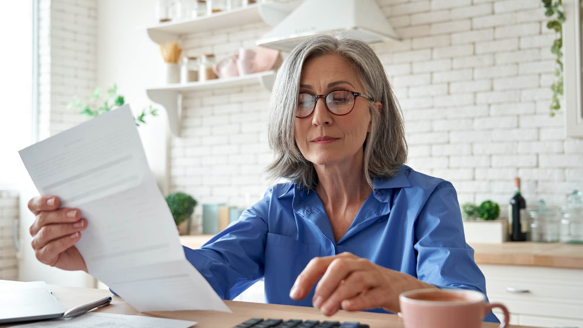 older woman budgeting her money