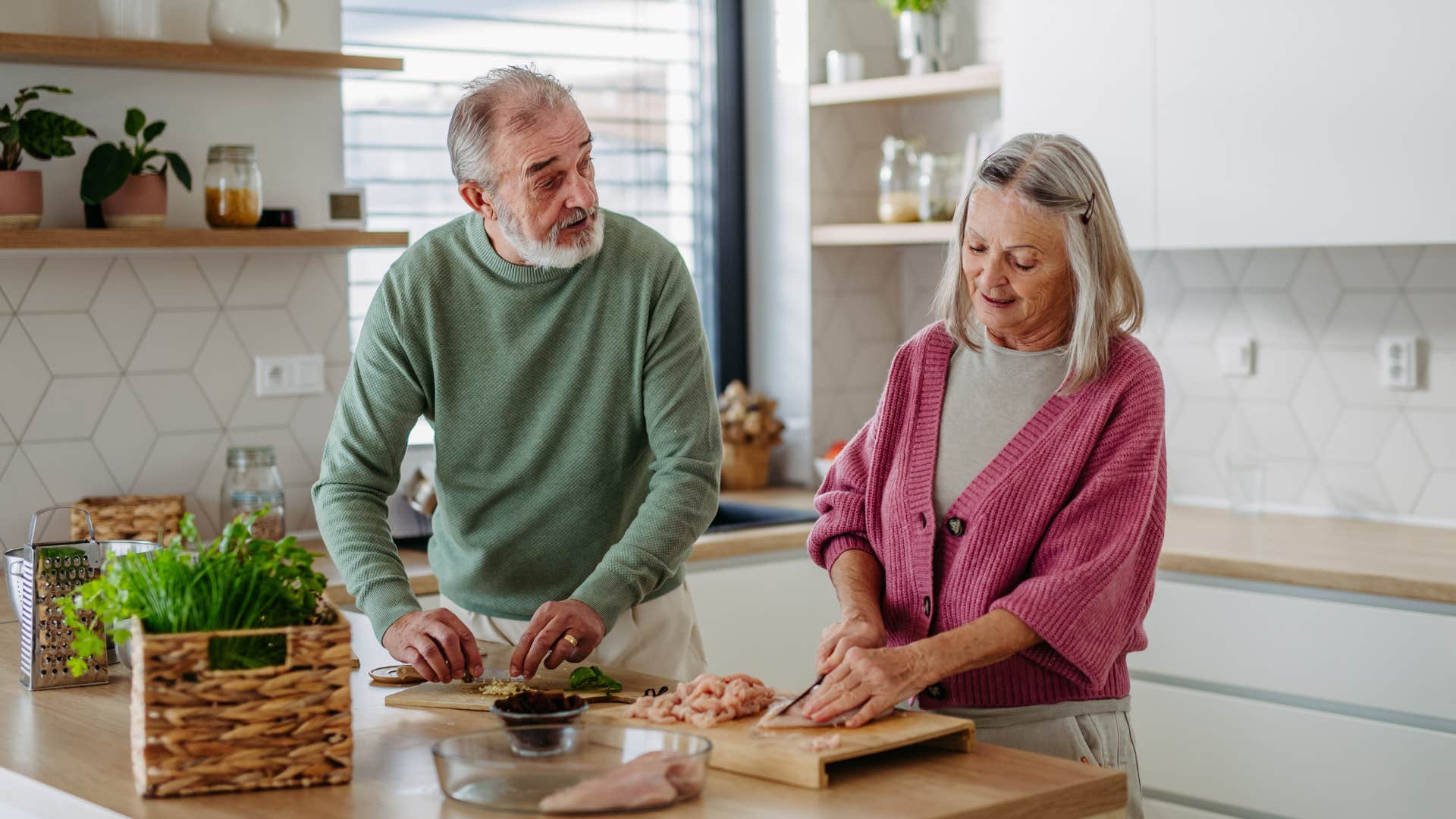 older couple creating remedies in their kitchen