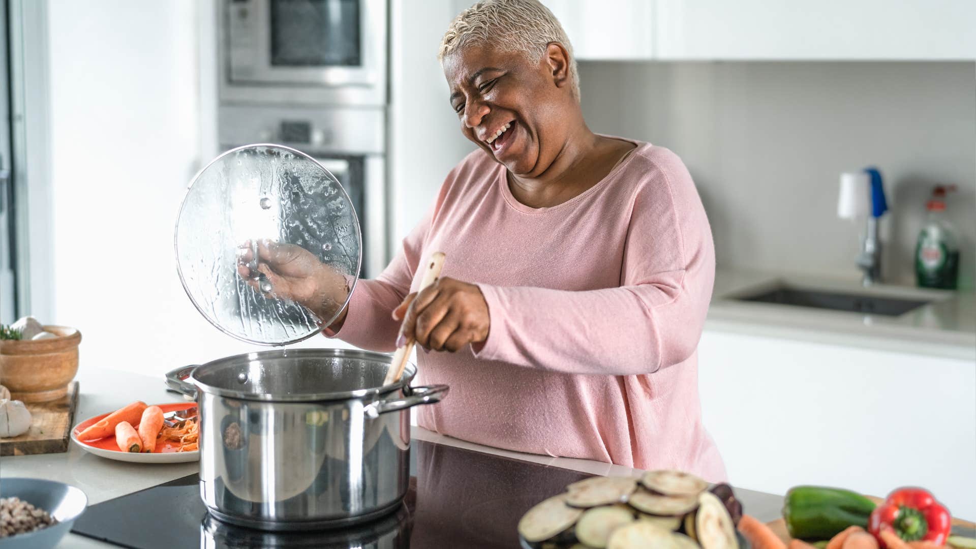 older woman cooking meal without reading a recipe