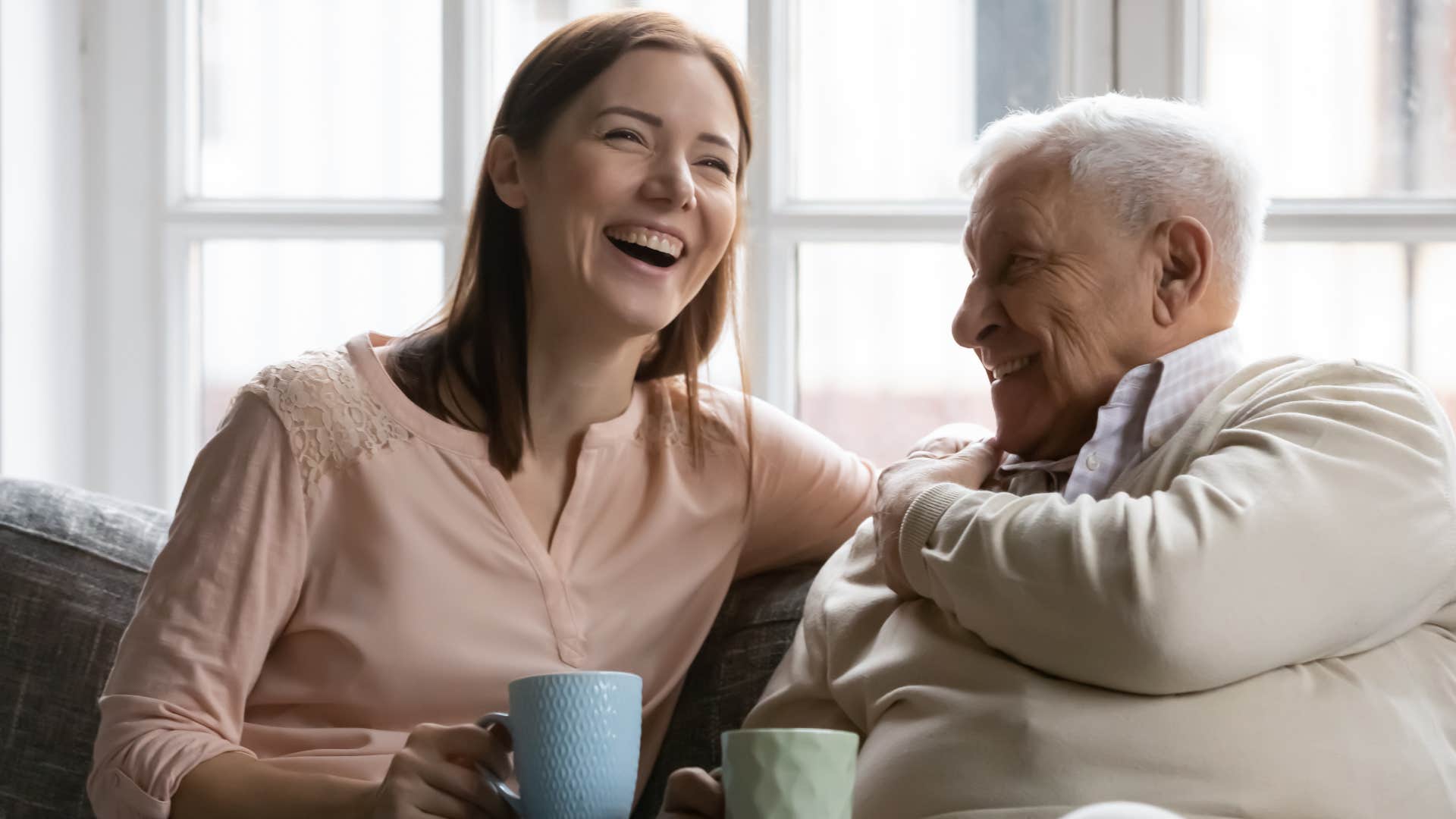 woman talking to her grandfather listening to his stories
