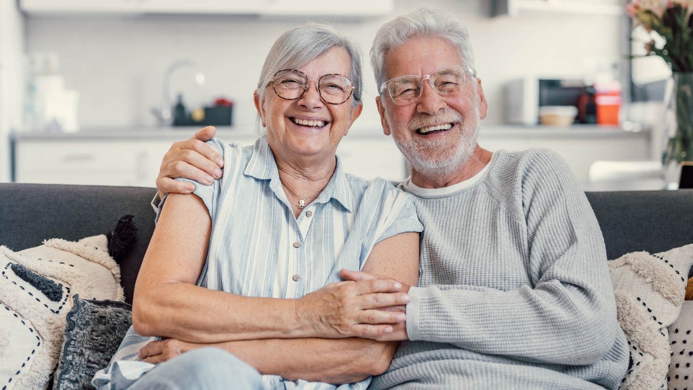 Forgotten Skills That Saved Your Grandparents During Tough Times older couple sitting next to each other on couch