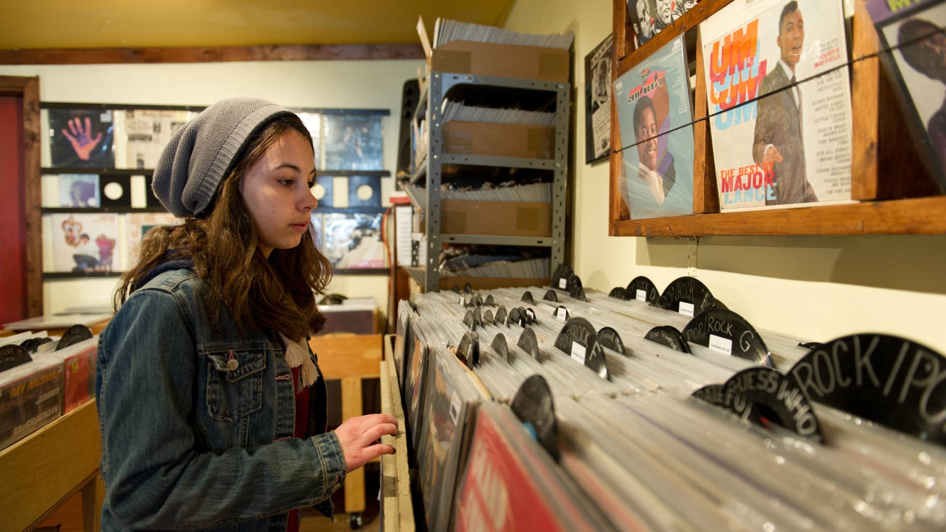 gen-z girl looking at vinyls