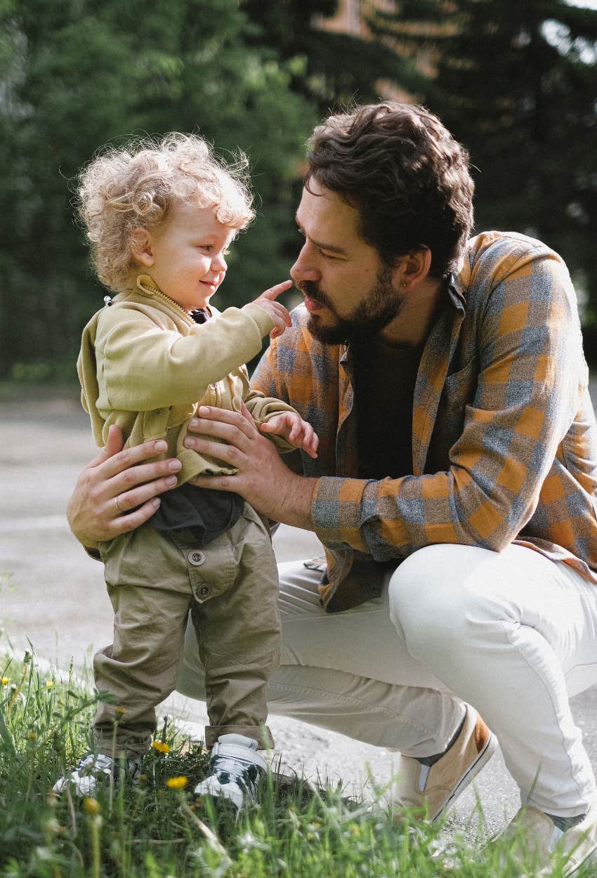 Little boy learning how to express emotions from his dad