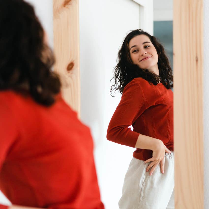 woman with boosted self-esteem because she sleeps buck naked