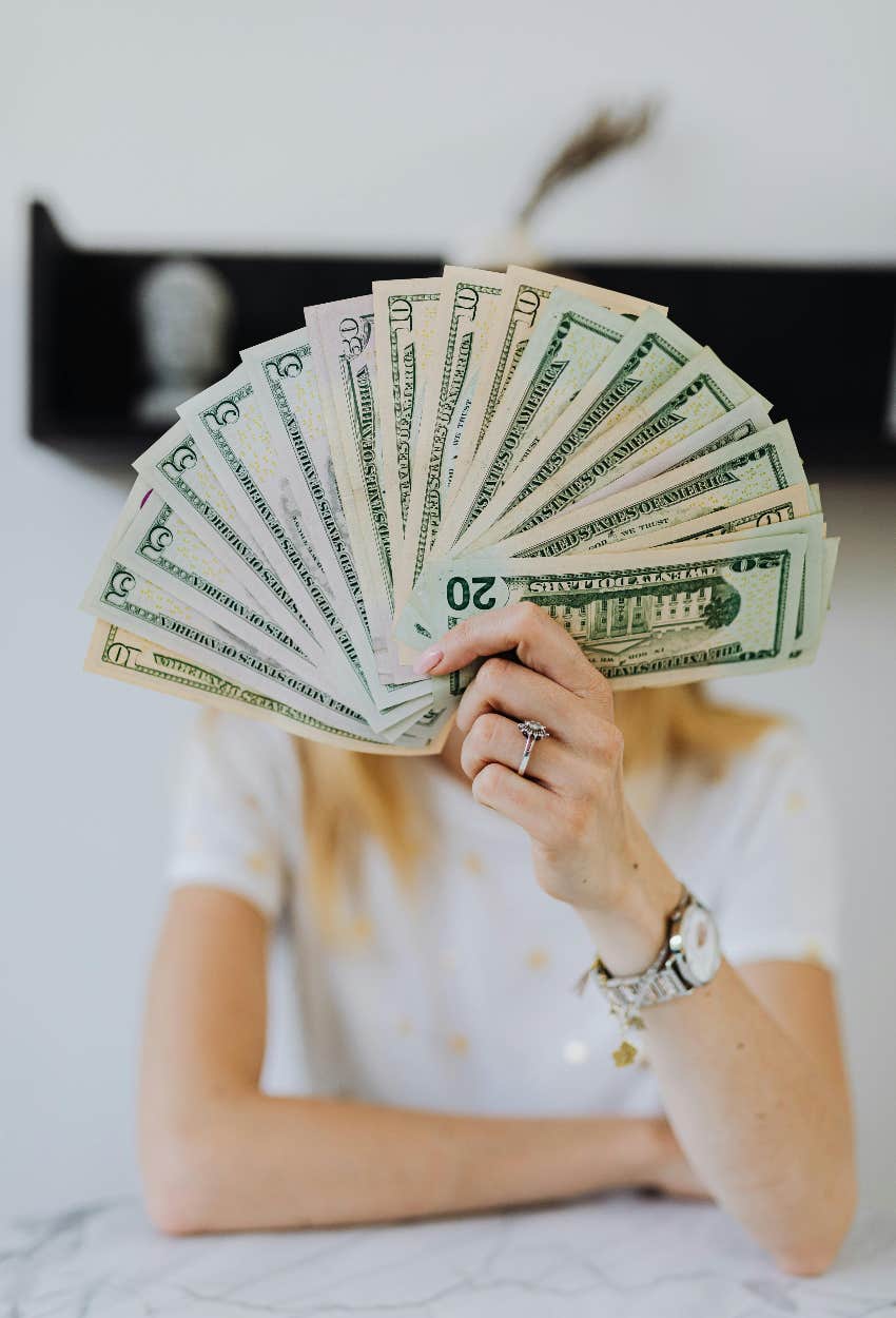 woman holding money