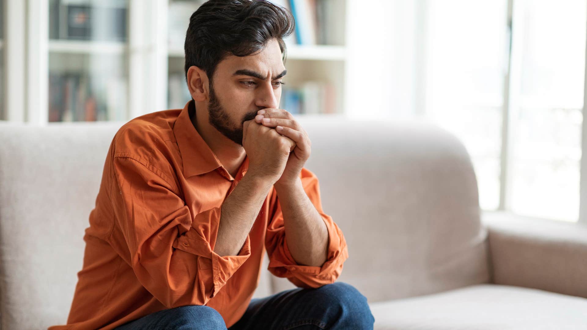 sad man with unresolved trauma looking upset