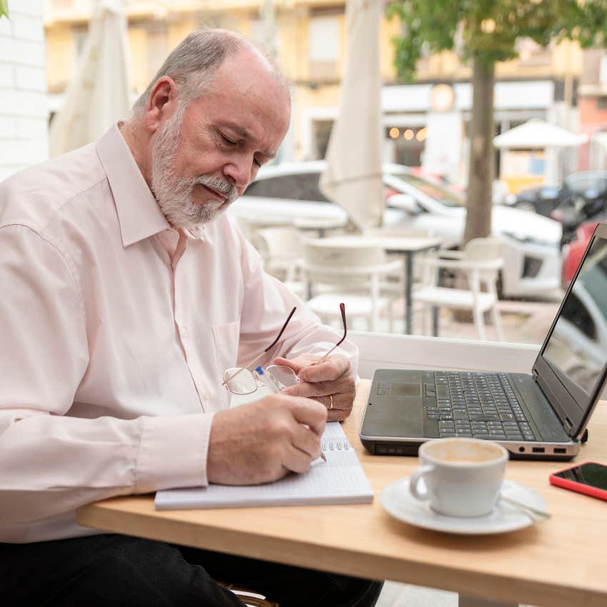 man with laptop after being fired before retirement