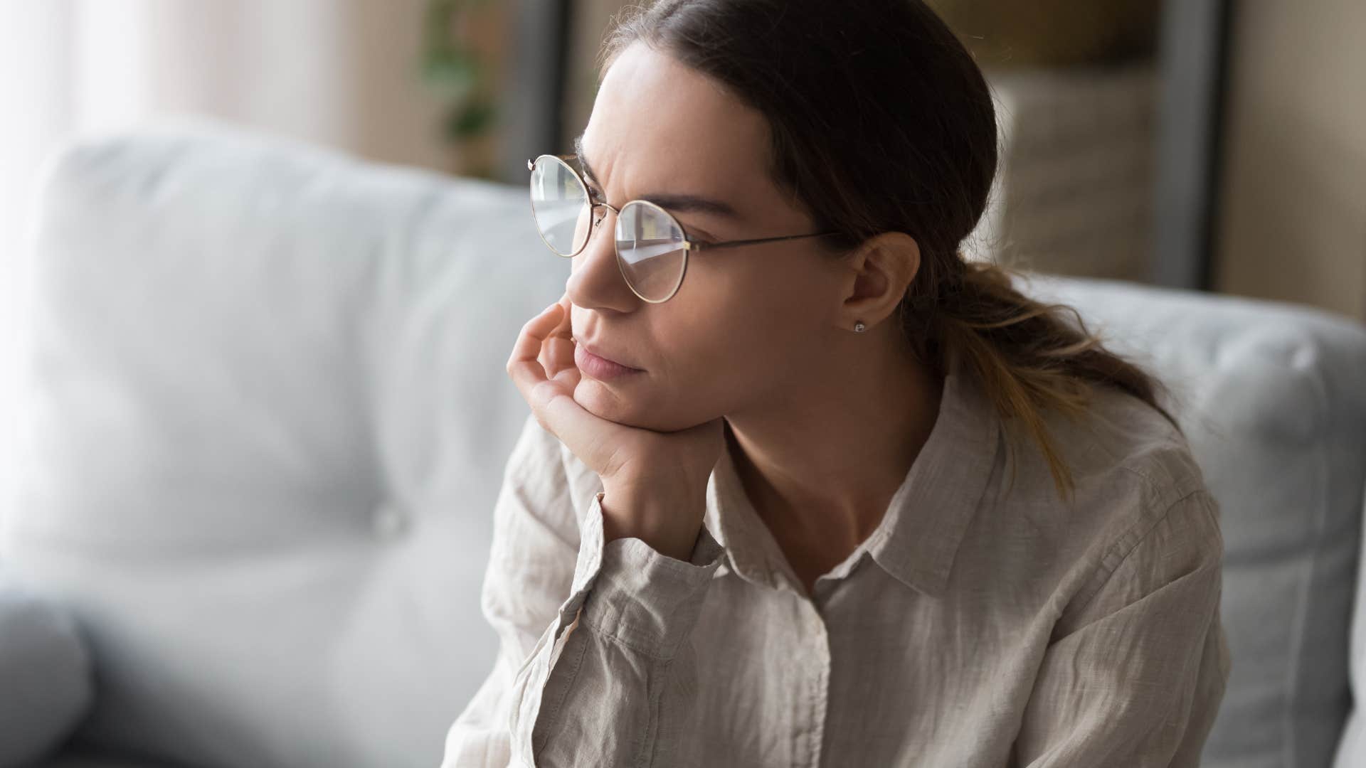 lonely woman who's grown out of her friend group sitting by herself