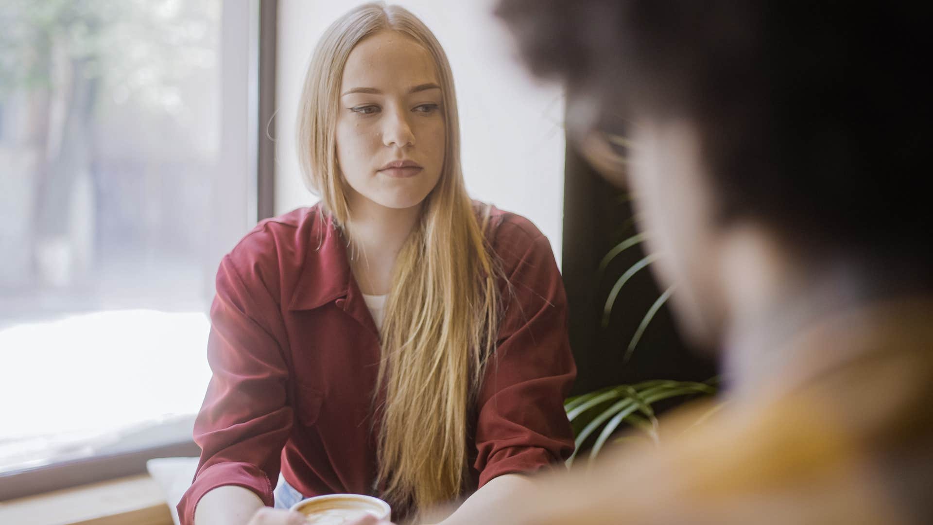 Woman who's the therapist friend talking to a man.