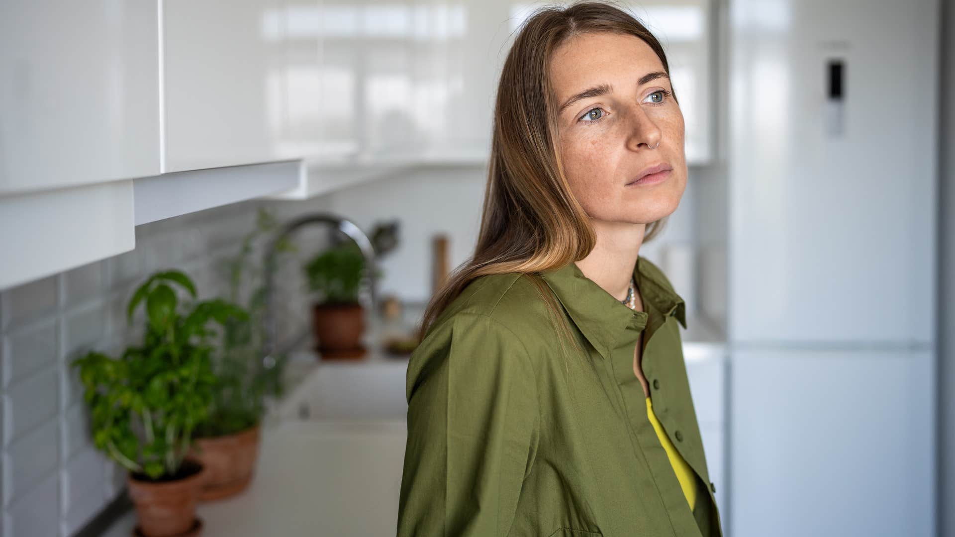 Woman whose values and goals don't align anymore looking away from the camera.