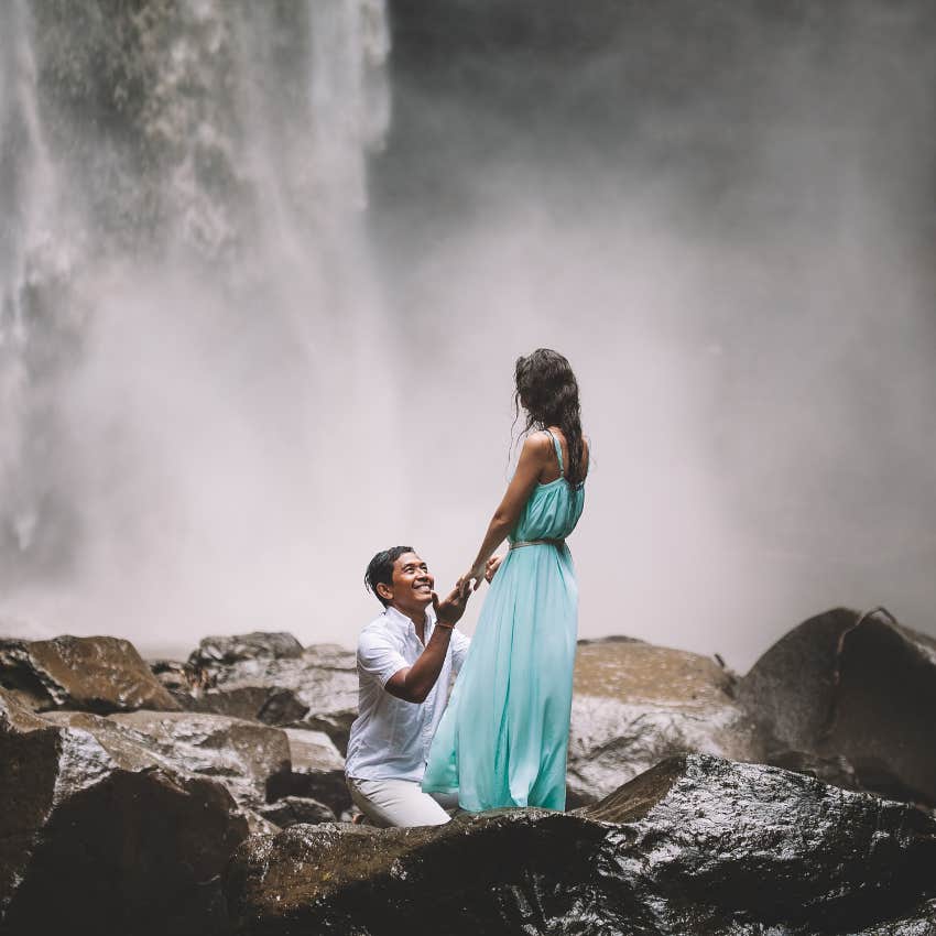 insanely creative marriage proposal at a waterfall