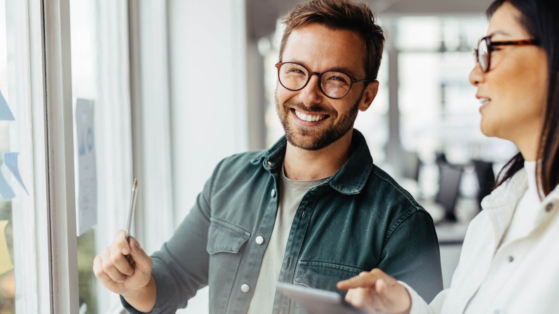 man experiencing a moment of creative excitement at work