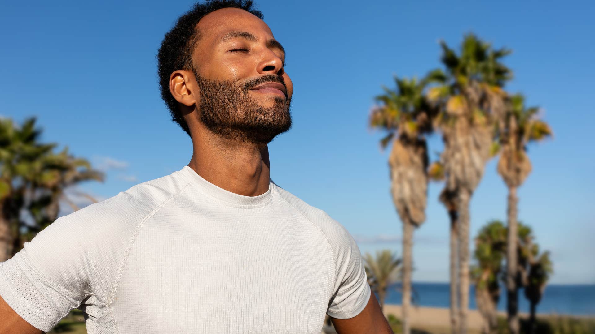 man feeling present outside in the sunshine