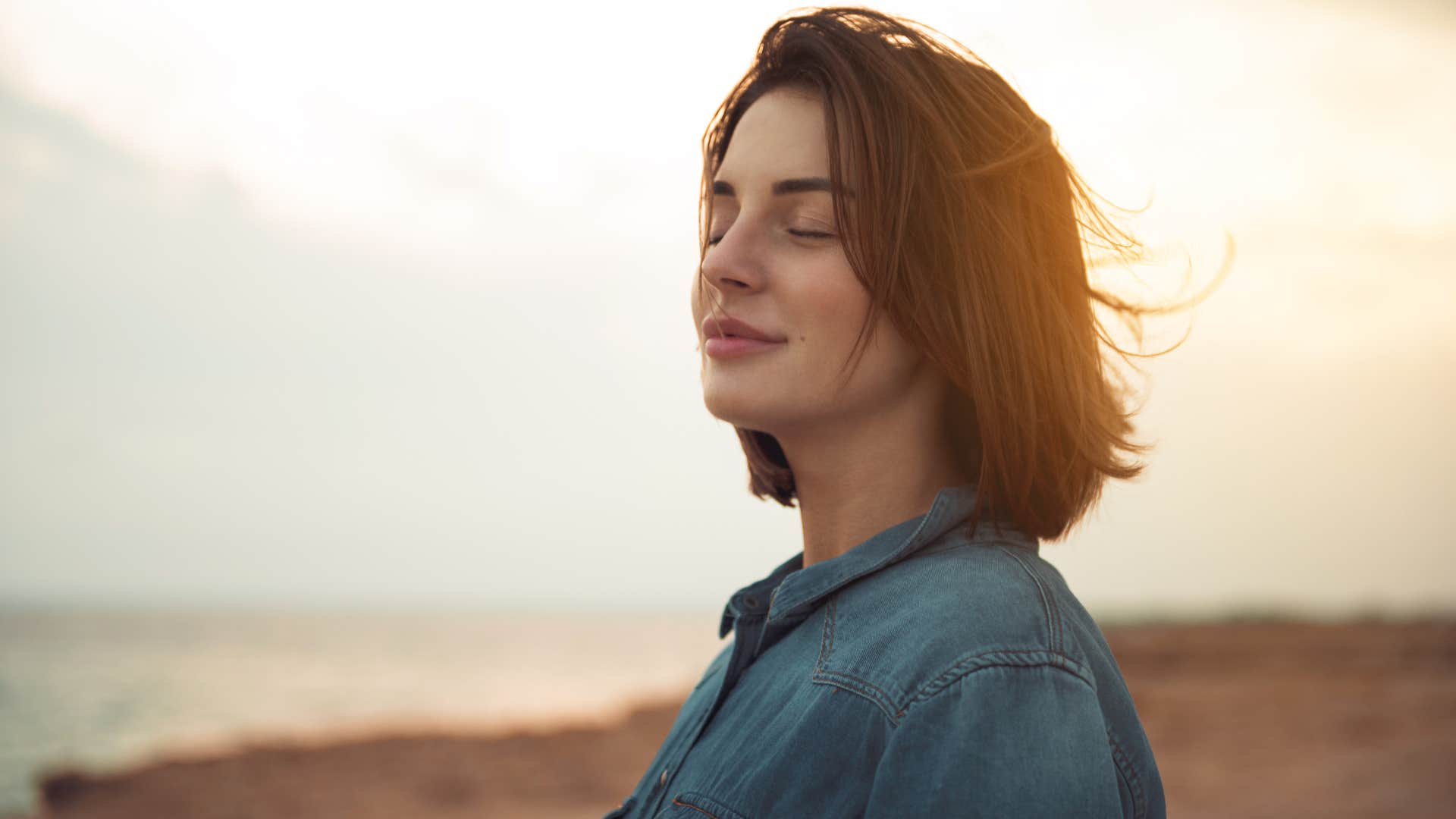 woman with a gut feeling closing her eyes