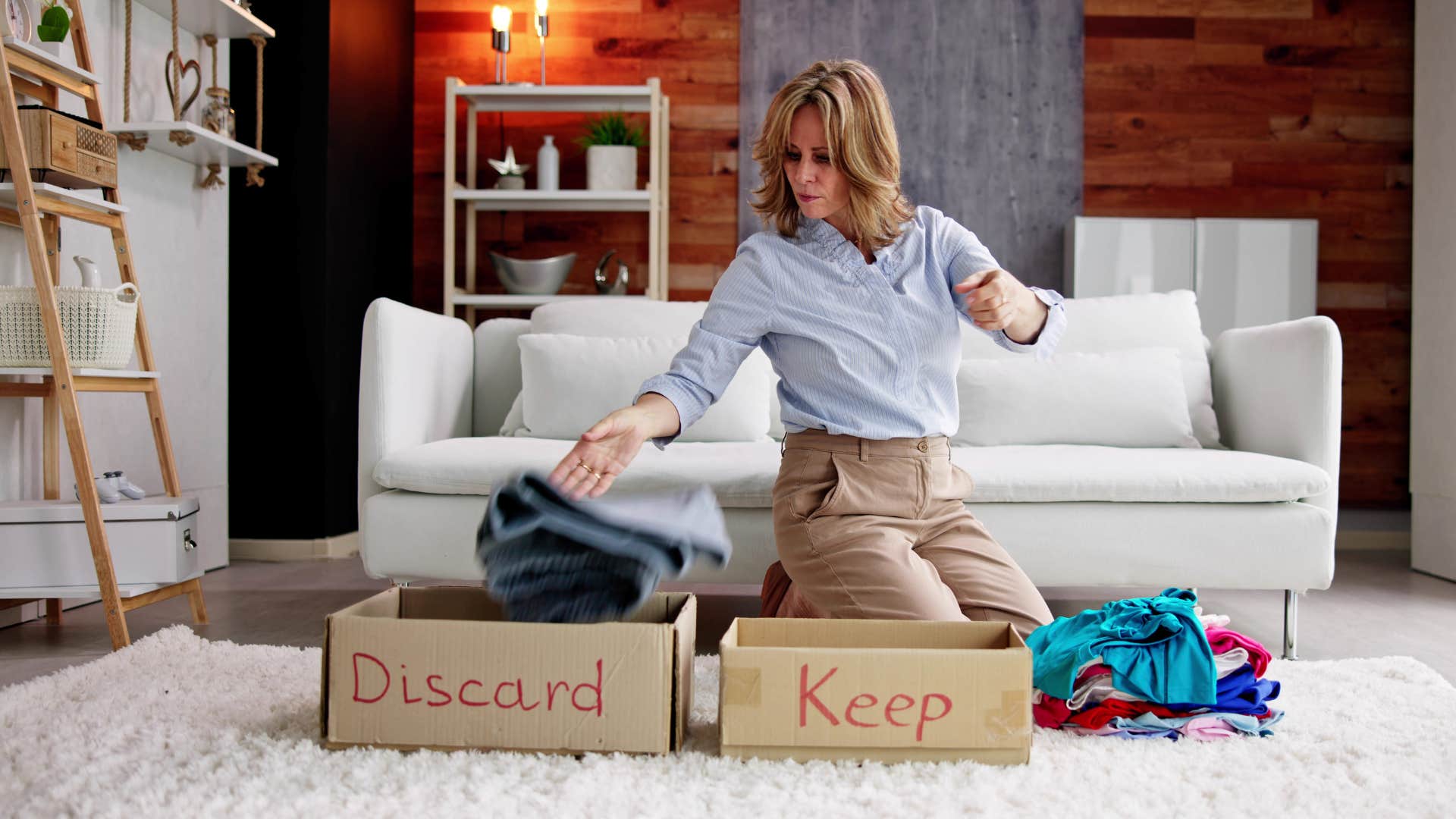 a woman tries to declutter her space for more mental clarity