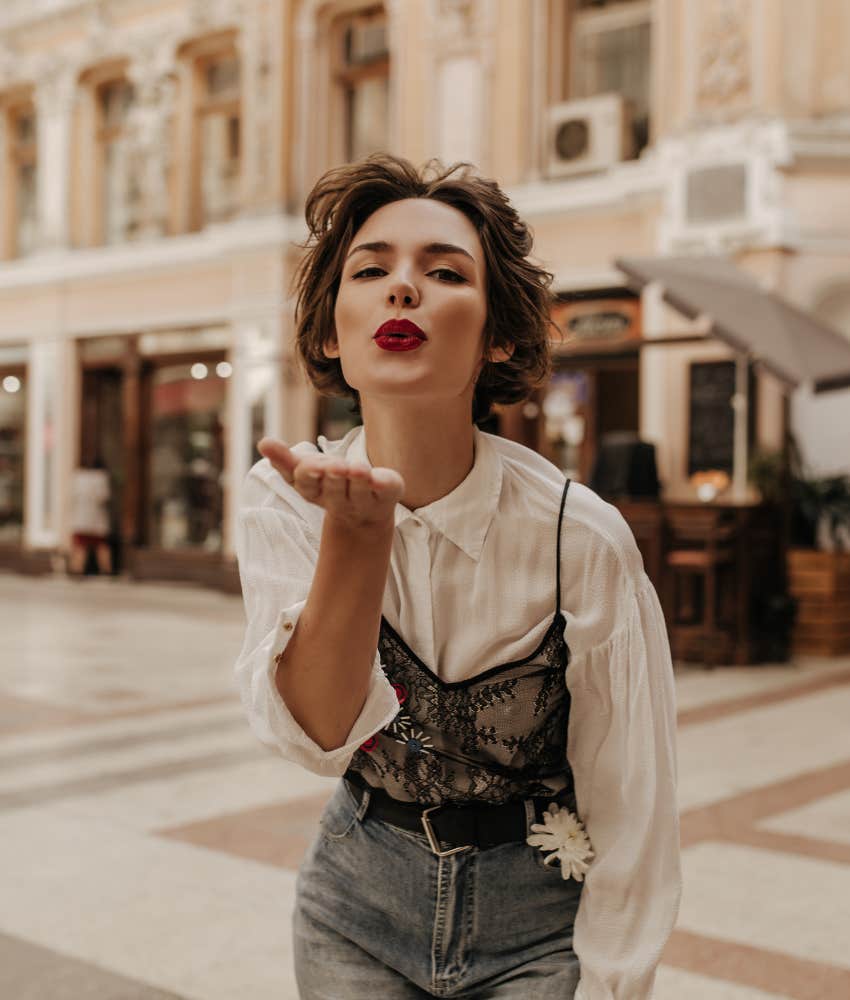 Woman in love throws a kiss