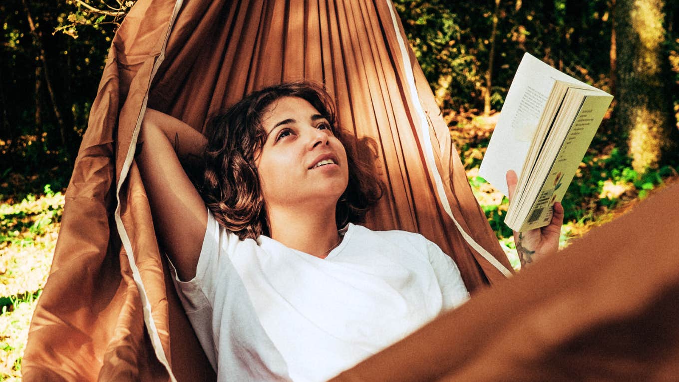 Woman on a hammock with low-effort habits, making life so much easier.