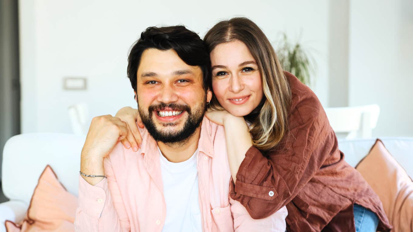 Meaningful Conversations That Strong Marriages Are Built On, According to Experts Strong married couple having meaningful conversations.