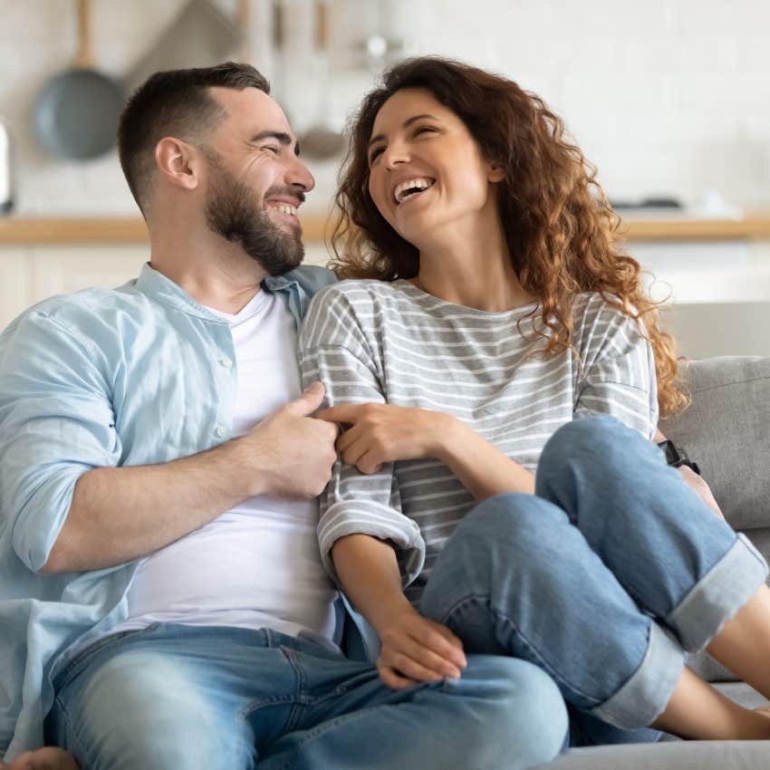 man noticing how woman laughs from her smile