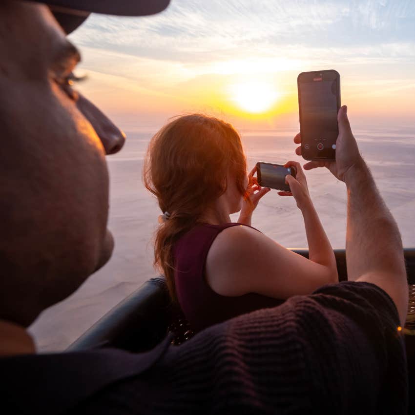 couple on romantic date of hot air balloon ride