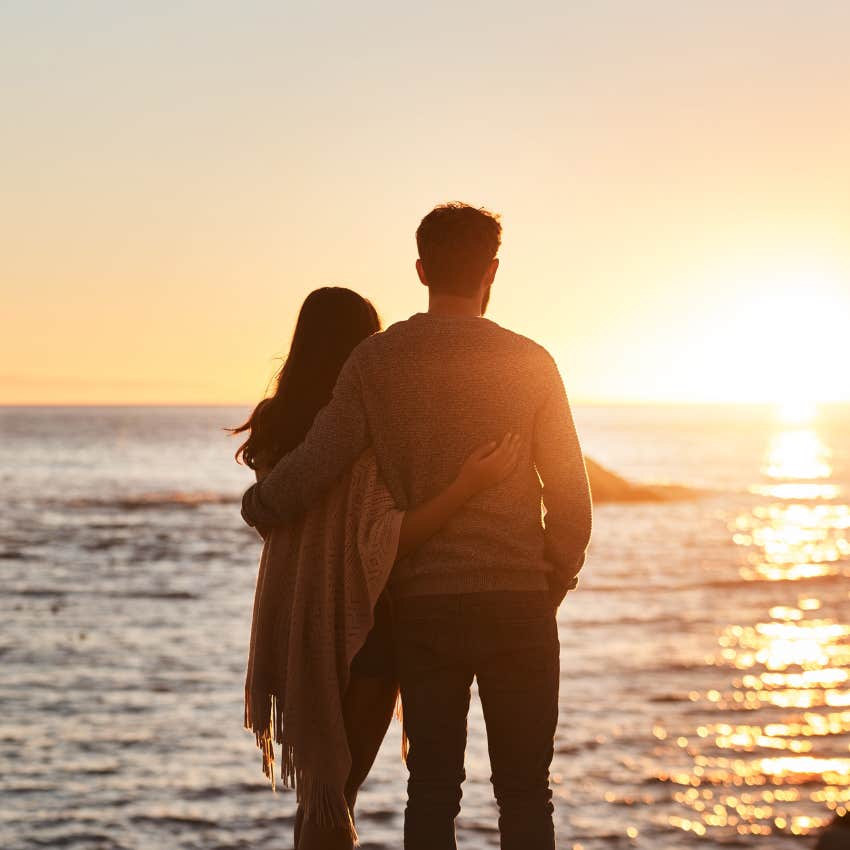 couple on romantic date watching the sunset