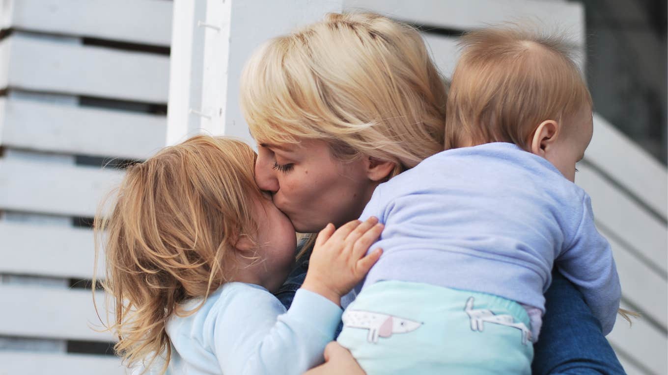 Mom kissing her first born admits to loving first more intensely