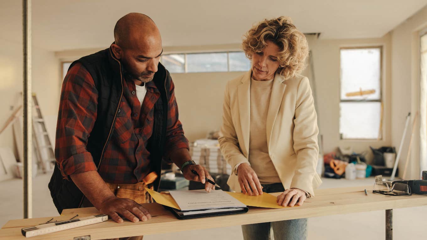 Mom reviewing plans to renovate house with a new gym instead of giving kids their own rooms