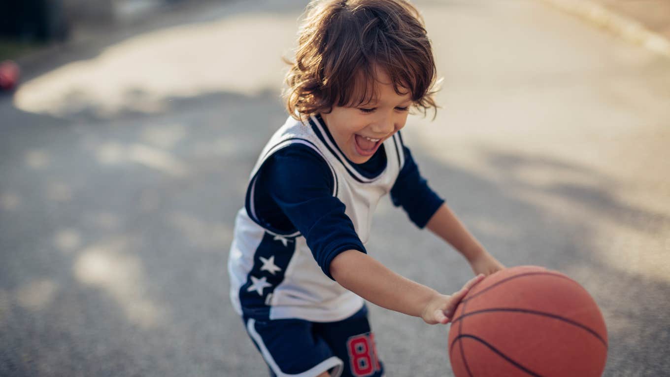 Neighbor Suing Family For Having A Basketball Hoop Boy playing basketball in driveway after neighbor sues family over hoop