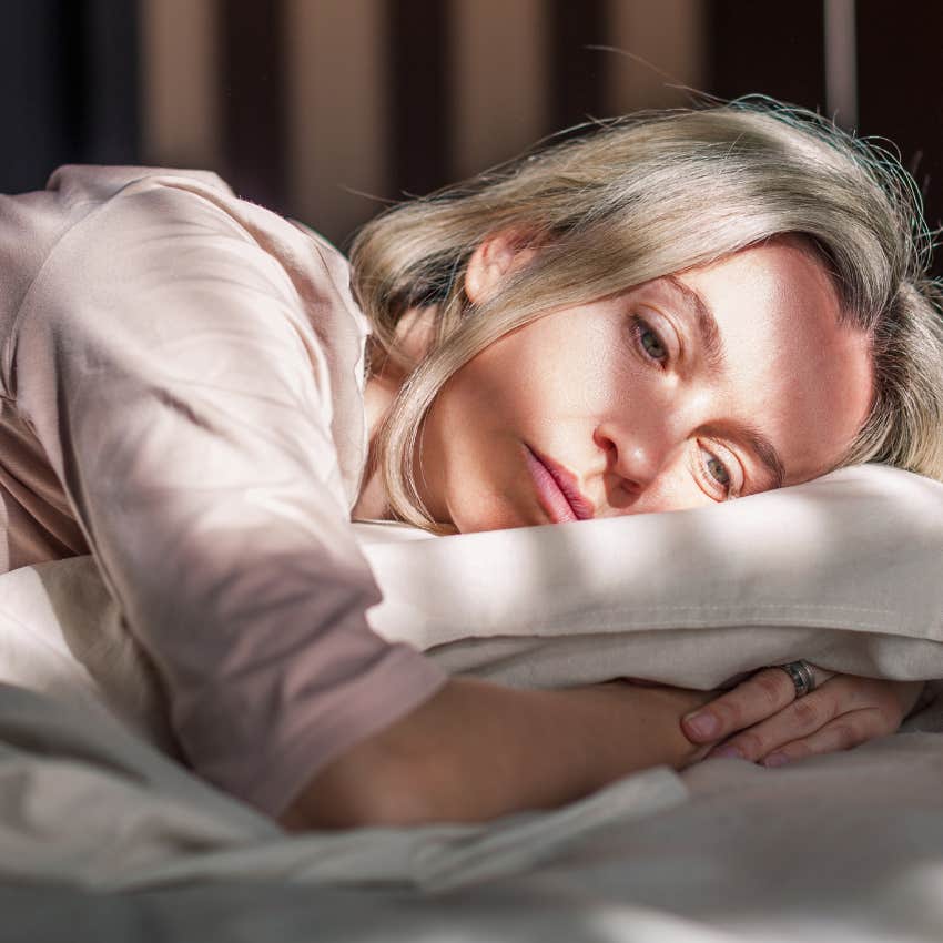 woman with no romance lying in bed