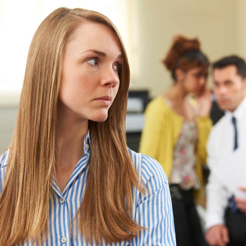 woman noticing workplace clique as giant red flag