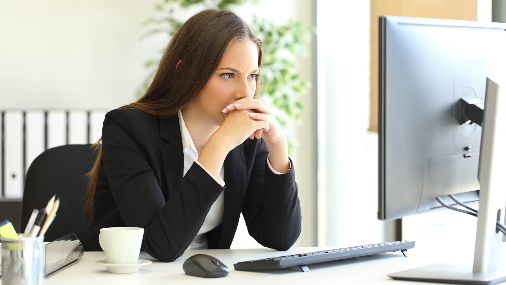 a woman reads between the lines of her bosses email