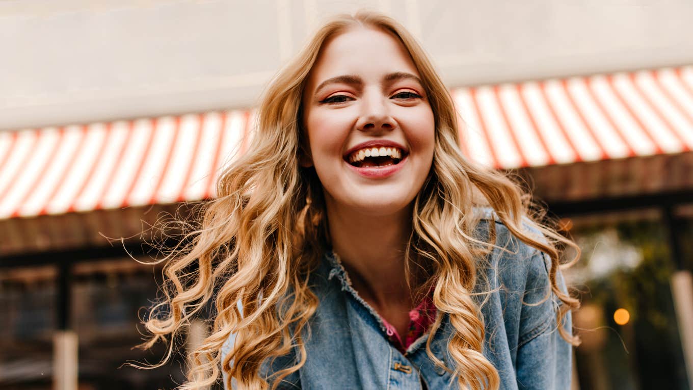 Old-Fashioned Manners You Were Taught If Your Parents Raised You Right happy smiling woman with manners