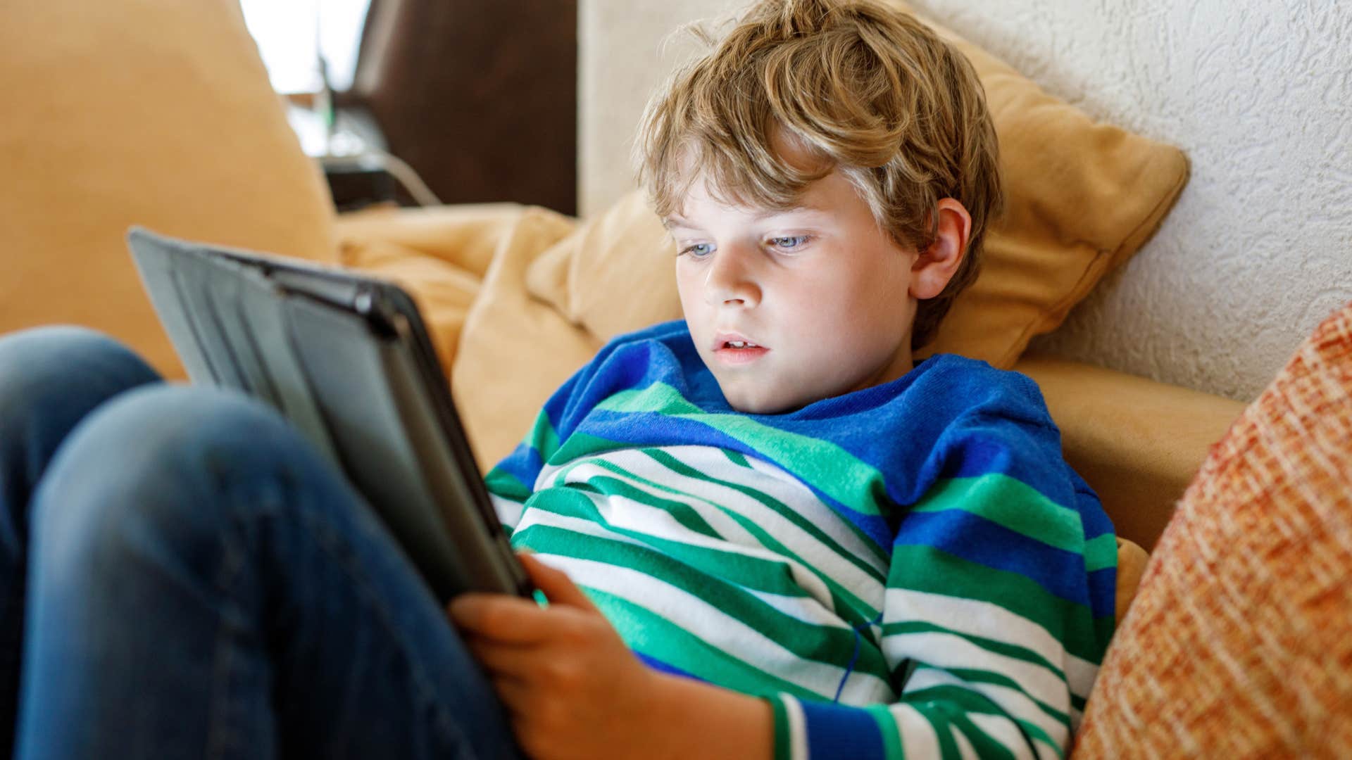 Parents distract kid with screen as habit