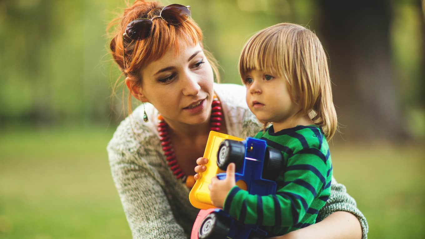 Parenting moment that reflects raising a child without a victim mentality A parent supports their child in a quiet moment reflecting how kids are raised without a victim mentality