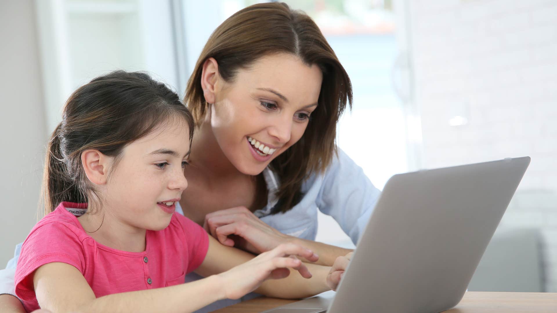a mother limits her daughters playtime on the computer