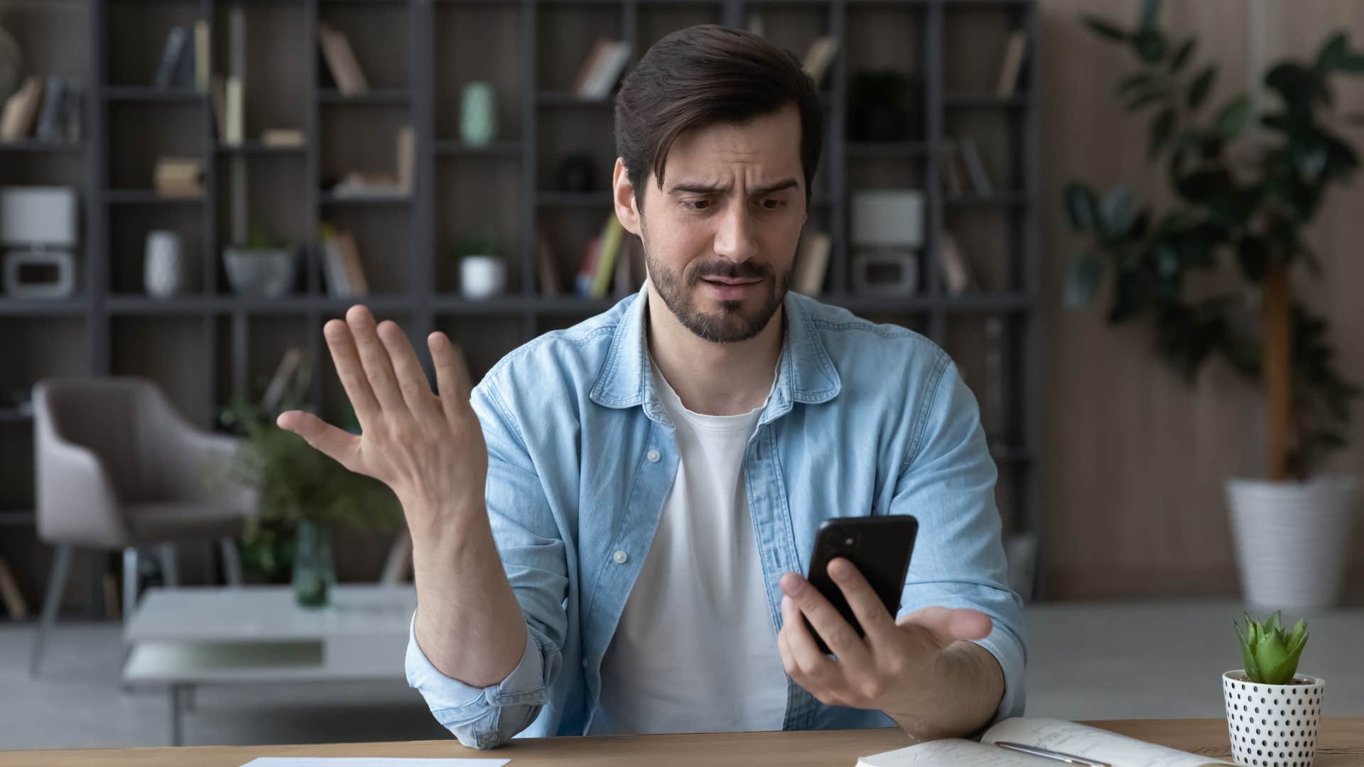 man in blue and white outfit looking annoyed as friend texts him we need to talk with no context