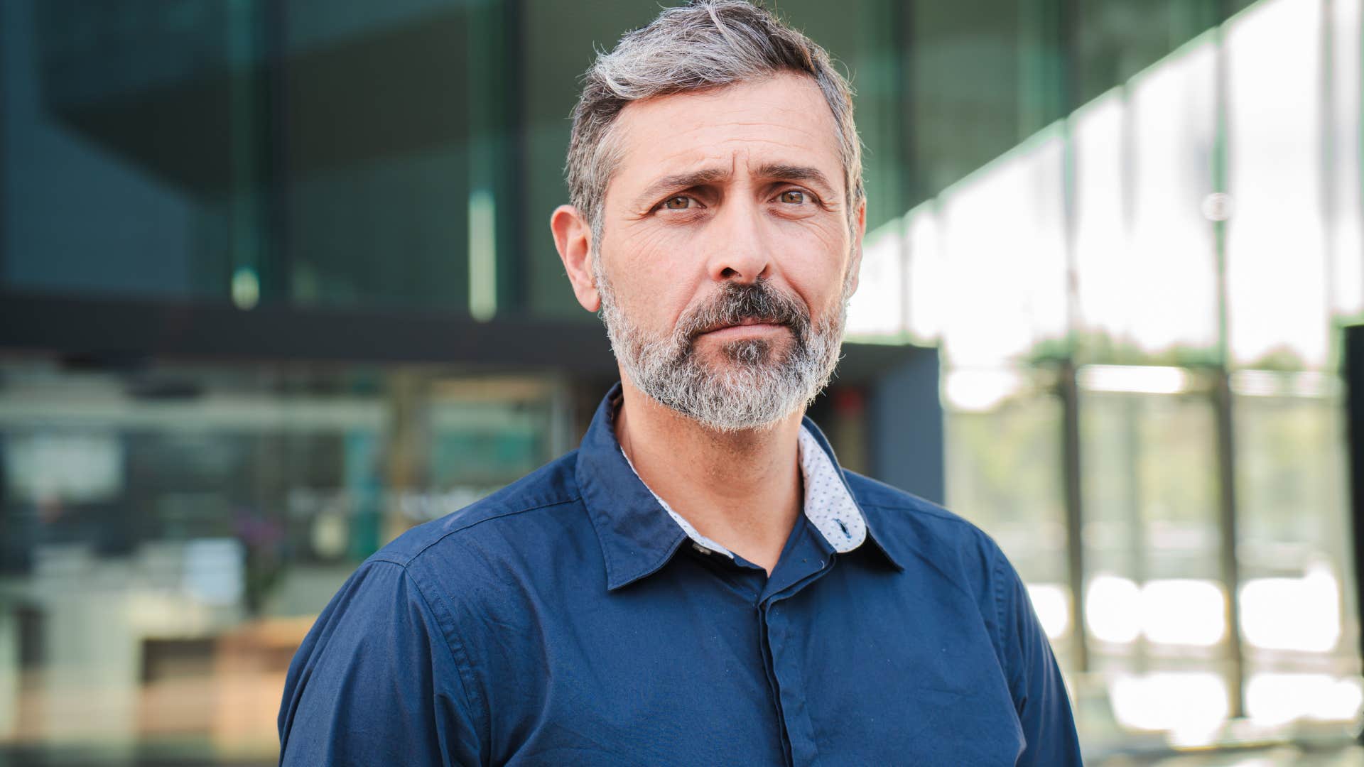 man thinking independently smiling subtly
