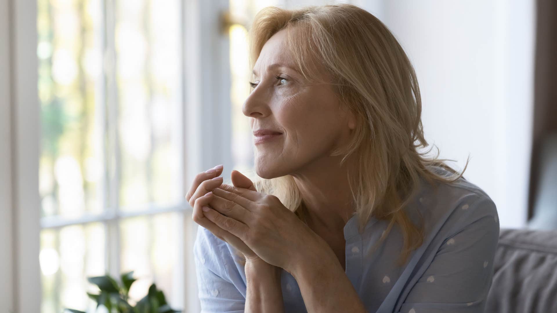 woman with a great memory smiling and thinking