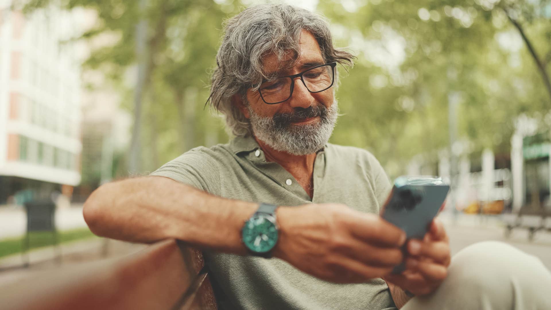 older man appreciating silence sitting on a bench